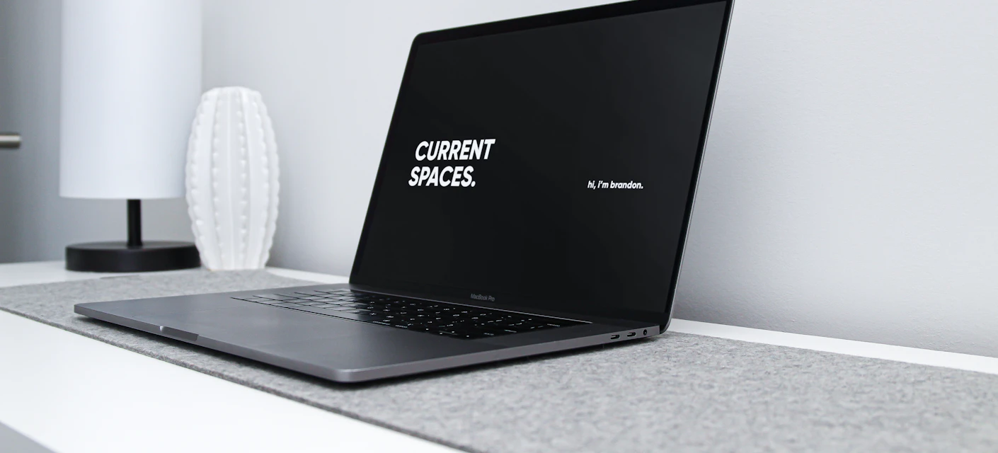 Laptop displaying a minimalist studio website