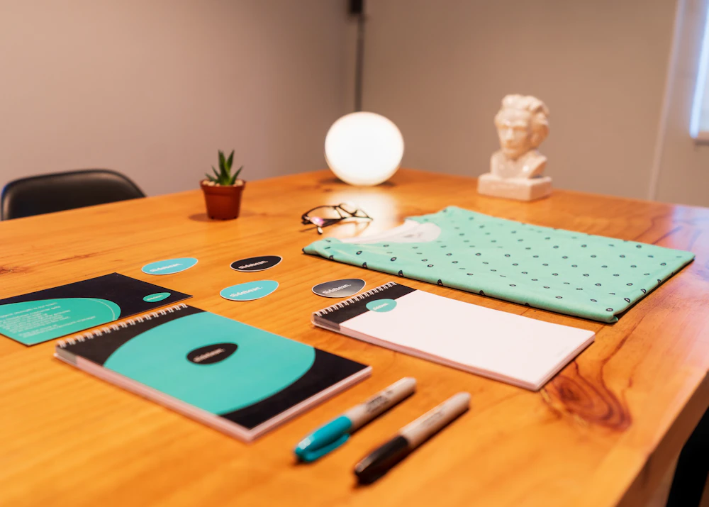 Brand stationery set laid out on a wooden table