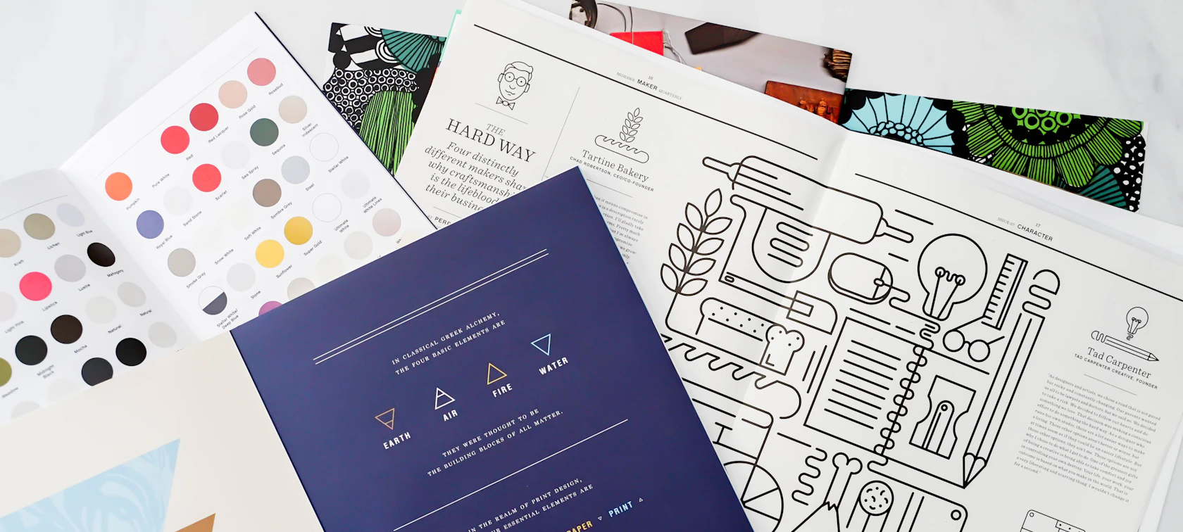 Brand identity design materials with color palette and printed pieces