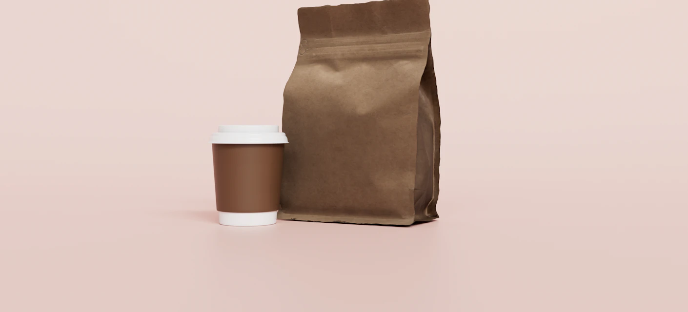 Coffee bag and takeaway cup packaging on a pink background