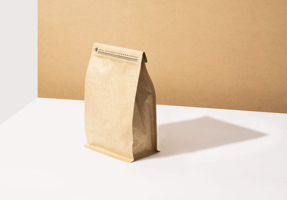 Kraft paper coffee bag on a white table