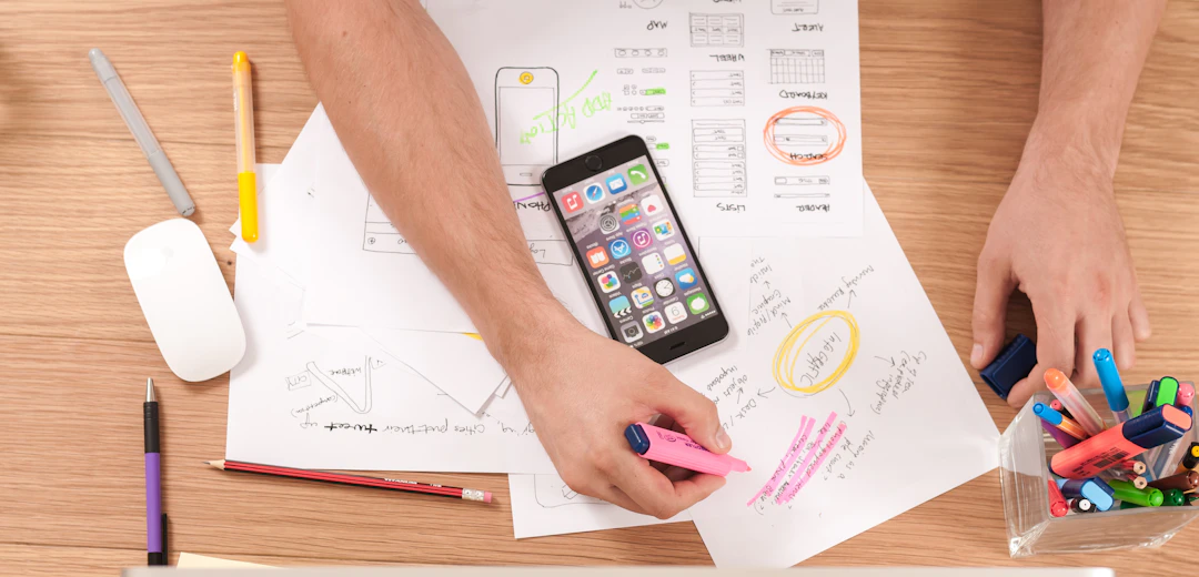 Person sketching a content plan on paper