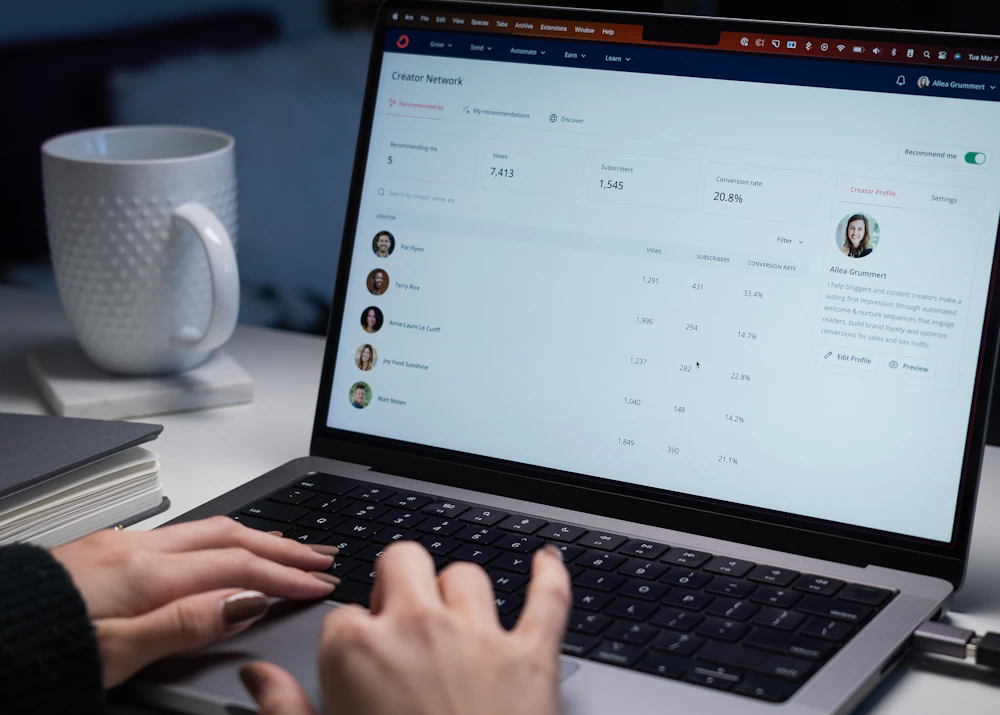 Person reviewing a contact list on a laptop