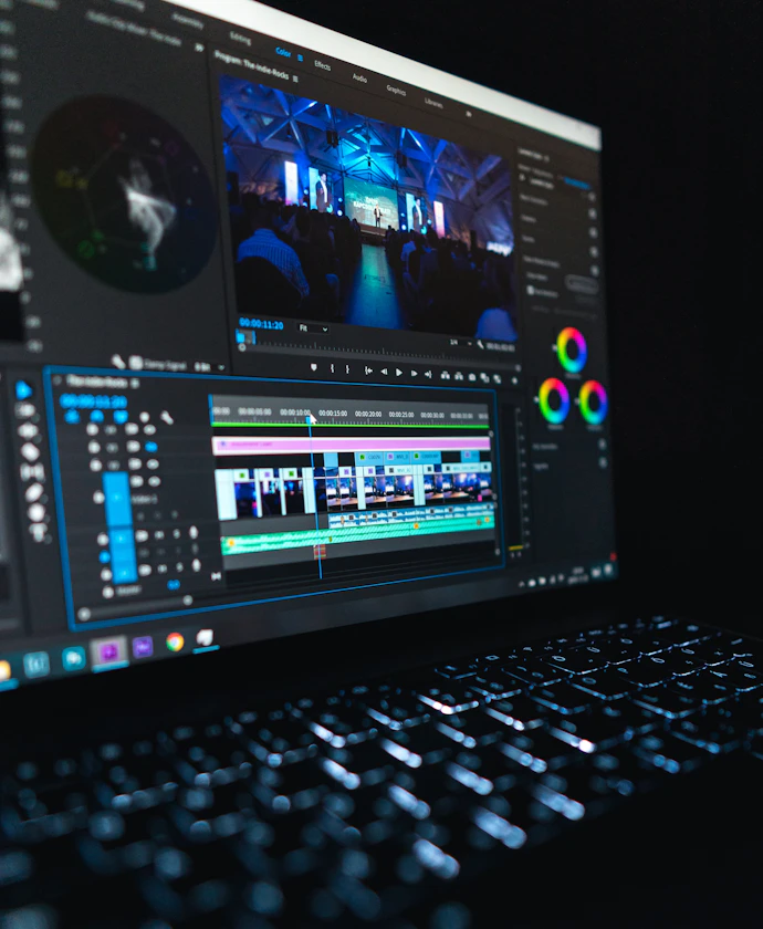 Laptop showing animation and color grading software