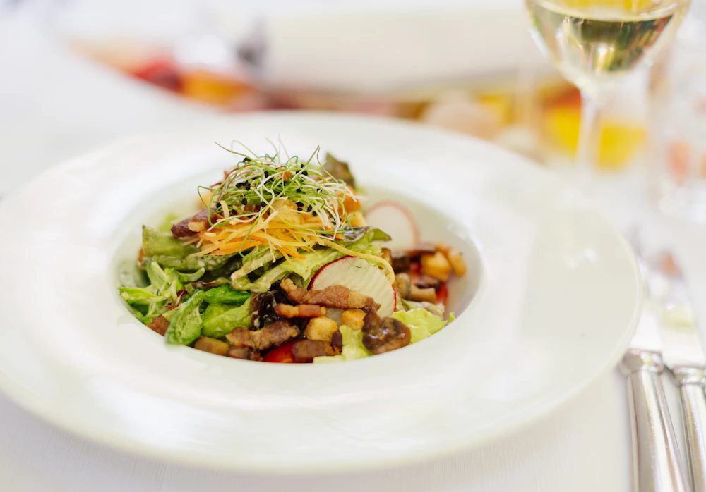 Plated salad on a white restaurant plate