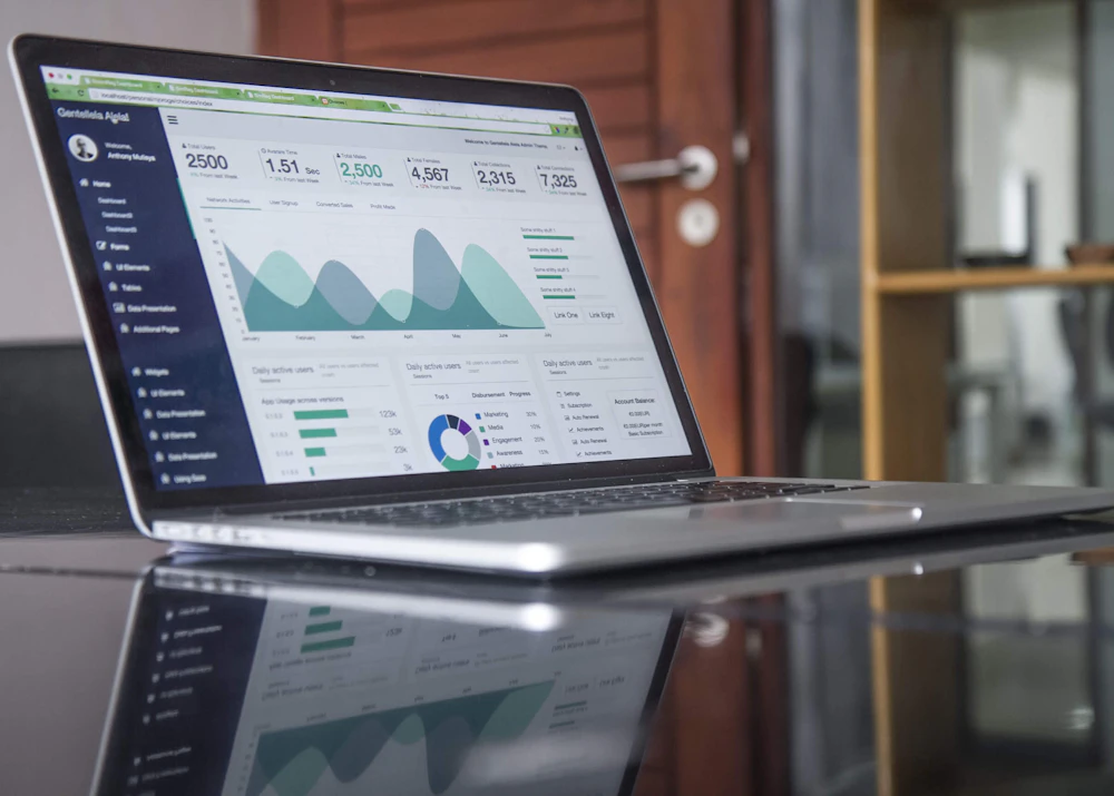 Laptop showing a paid advertising analytics dashboard