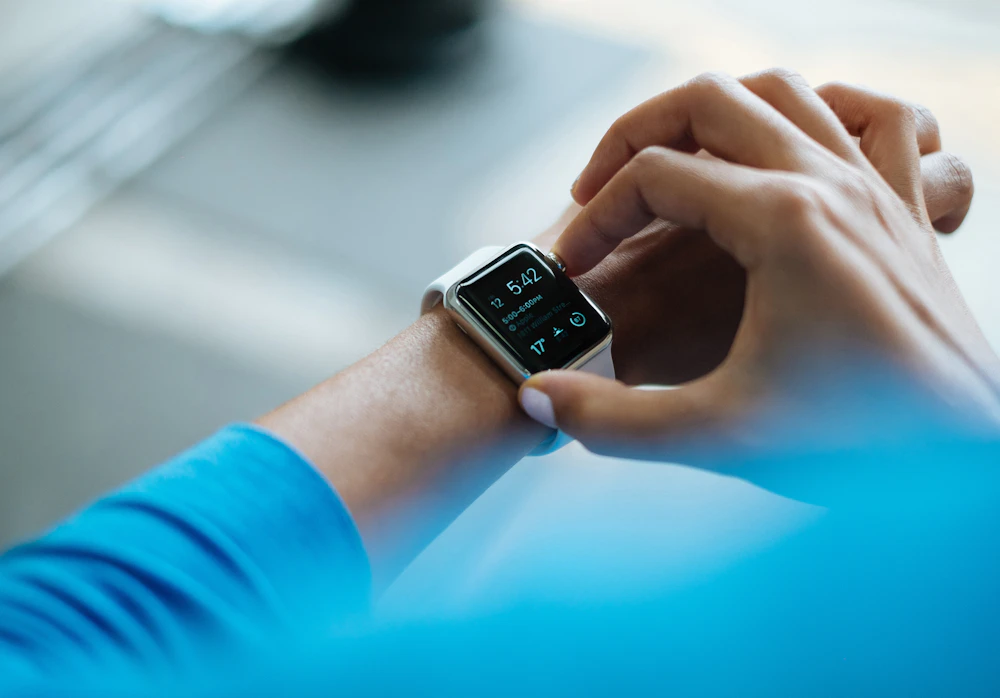 Person checking a workout on a smartwatch