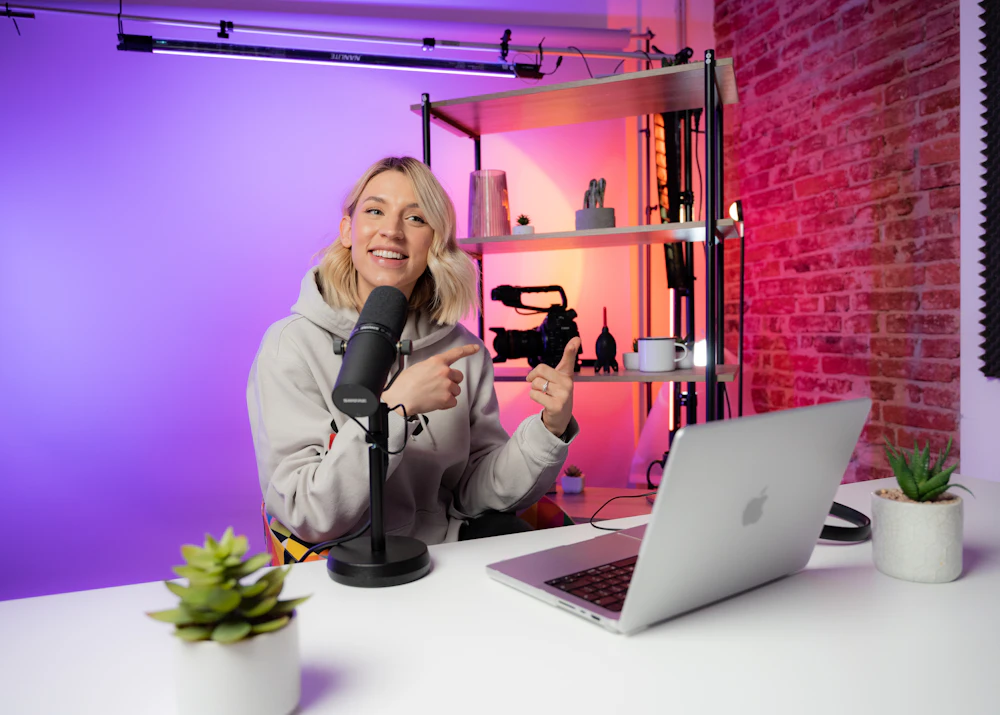 Content creator recording a video at her desk