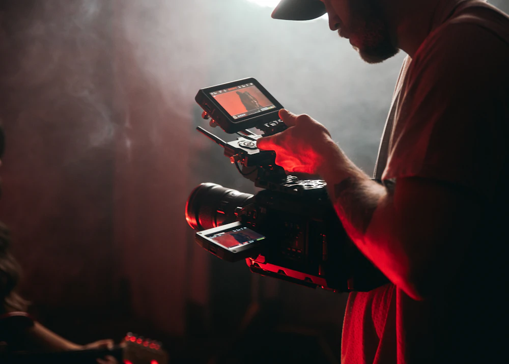Videographer checking a shot on a video camera