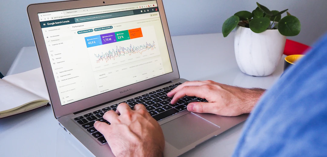 Person reviewing website analytics on a laptop